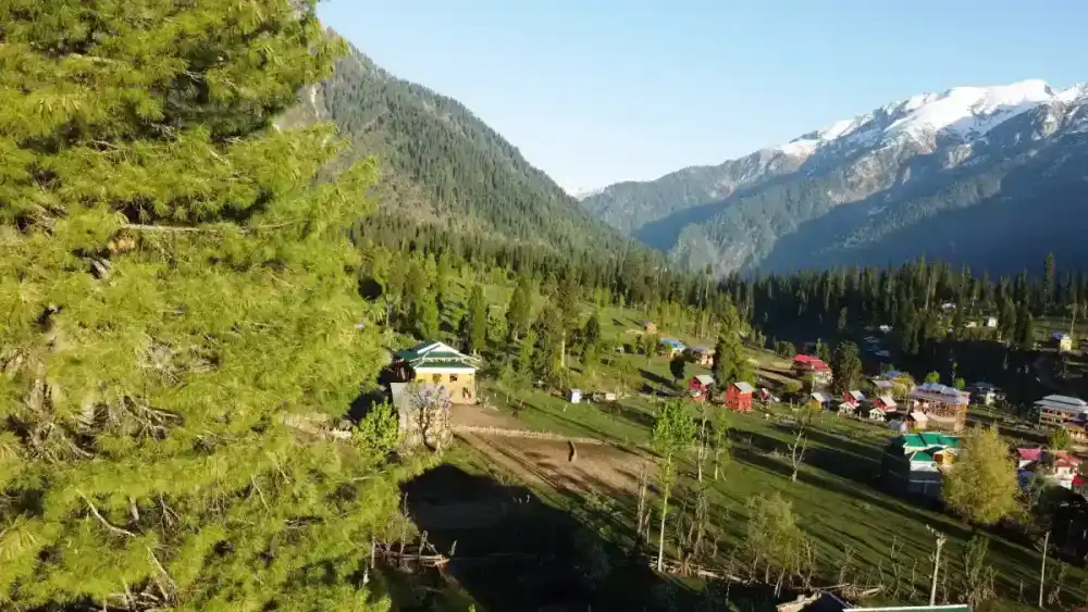 Snowy peaks surrounding a luxury resort in Gulmarg Kashmir