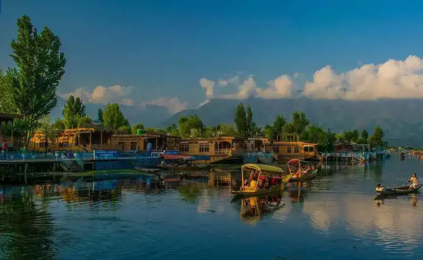 A couple enjoying a Shikara ride in Dal Lake during sunset